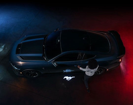 2024 Ford Mustang® Dark Horse™ model with a driver approaching the vehicle | Al Packer Ford West Palm Beach in West Palm Beach FL